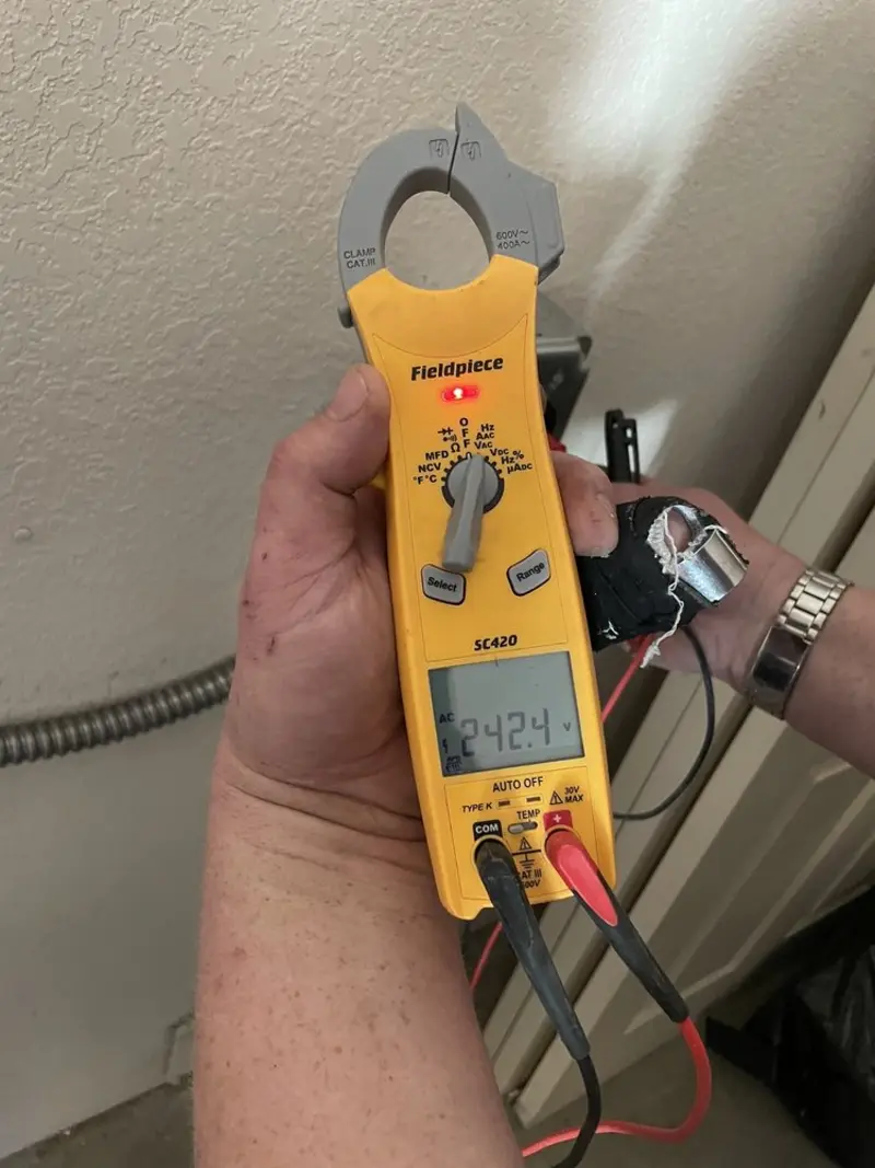 Voltage testing with clamp meter during Recessed Lighting Installation in Richton Park
